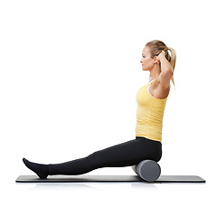 Image showing Core workout, foam roller and studio woman with posture exercise, pilates balance or gym performance challenge. Ground, body training and athlete sitting on fitness club equipment on white background