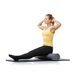 Image showing Studio workout, yoga foam roller and woman with posture fitness, spine rehabilitation or stretching exercise for recovery process. Floor, training and person sit on gym equipment on white background