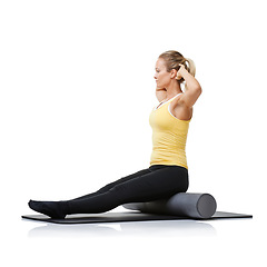 Image showing Studio fitness, foam roller and pilates woman with posture training, core wellness challenge or active stretching exercise. Ground, yoga mat and profile of physical activity girl on white background