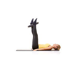 Image showing Woman, pilates ring and legs for workout on yoga mat for resistance training, strong thighs or studio white background. Female person, equipment for muscle flexibility or exercise, health or mockup