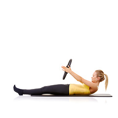 Image showing Woman, pilates ring and arms for exercise training on yoga mat for resistance healthy, strength or studio white background. Female person, equipment for muscle flexibility, core balance or mockup