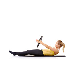 Image showing Pilates ring, fitness and woman exercise in studio isolated on a white background mockup space. Training, person on mat and magic circle for crunches, strong abdomen and healthy body workout on floor