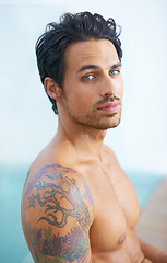 Image showing Man, topless and portrait or confidence outdoor for cool style, edgy tattoo or relax muscles. Male person, face and shirtless outside or healthy fitness or calm at holiday vacation, beach or travel