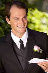 Image showing Man, paper and outdoor at wedding marriage for commitment ceremony, promise speech or romance party. Male person, vows and reading as groom for partnership celebration, relationship trust or love