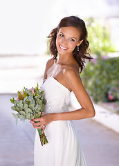 Image showing Smile, flowers and a woman on her wedding day as the bride for a ceremony of love or tradition. Street, event and bouquet with a happy young person looking excited for marriage celebration in a dress