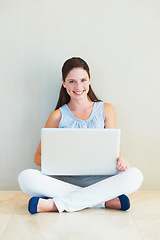 Image showing Happy woman, portrait and laptop for social media, communication or networking at home. Female person or freelancer smile and sitting against wall on computer for online research on mockup space