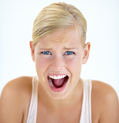 Image showing Portrait, screaming and woman scared, fear and yelling isolated on a white studio background. Face, shouting and blonde person in horror, stress facial expression and surprise, shocked and angry