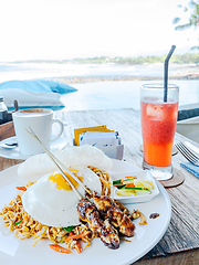 Image showing Indonesian food, mie goreng and chicken satay