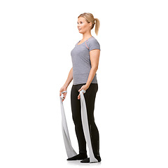 Image showing Health, resistance band and woman doing exercise in studio for fitness, wellness and bodycare. Sports, full length and young female person from Canada with arm workout or training by white background