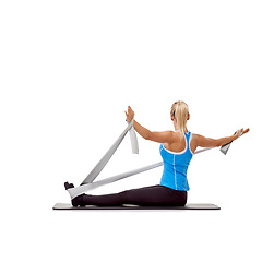 Image showing Sport, resistance band and woman doing exercise in studio for health, wellness and bodycare. Fitness, yoga mat and young female person from Australia with arms workout or training by white background