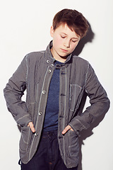 Image showing Sad, teenager and insecure boy in studio, white background or thinking about fashion. Child, anxiety and worry for style, clothes and struggle with emotions, thoughts and personality in backdrop