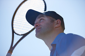 Image showing Tennis match, fitness and man in outdoors, competition and playing on court at country club. Male athlete person, challenge and exercise or racket for game, performance and practice or cardio workout