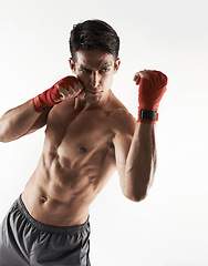 Image showing Man, kick boxer and topless in gym, serious and face for workout, boxing and strong. Exercise, sports and training for power, self defense and concentration for challenge, mma and fighting skills