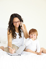 Image showing Phone call, writing and a single mother with her baby in the bedroom of a home, planning to multitask. Book, family or kids with book with a happy young woman and her infant child sitting on a bed