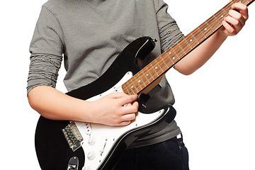 Image showing Hands, guitar and studio performance for rock music, playing or concert in closeup by white background. Creative person, artist or musician in clothes, instrument and art with song, band or fashion