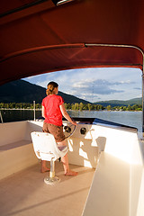 Image showing Woman Driving a Yacht