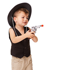 Image showing Kid, cowboy hat and play with gun in studio isolated on a white background mockup space. Child, toy pistol and western costume for halloween, shooting and cute young boy dress up on holiday for fun