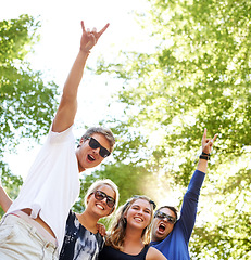 Image showing Friends, face or rocker hands for park music, festival or happy social gathering. Freedom, celebration or crowd of people at forest party, concert or event in nature with excited, energy or gesture