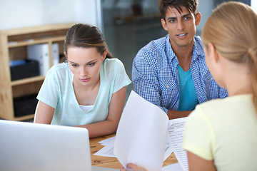 Image showing Business people, documents and laptop for meeting, office planning and teamwork, collaboration or research. Young group of men, women or employees with paperwork, financial strategy and computer