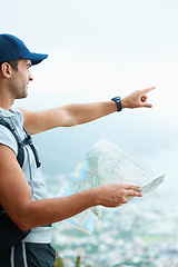 Image showing Map, hiking and man with nature, pointing and adventure with direction, journey and fitness. Person, hiker and guy with wellness, outdoor ot document for location, fresh air and landscape with forest