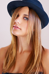 Image showing Hipster, hat and portrait of woman with vintage, fashion and confidence in white background or studio. Retro, style and face of person in old fashioned fedora with makeup, cosmetics and beauty