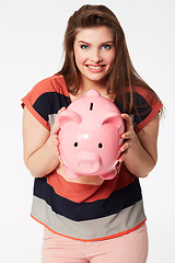 Image showing Finance, portrait and woman with piggy bank in studio for savings, payment our budget on white background. Money, box or face of person with cash container for investment or future financial freedom