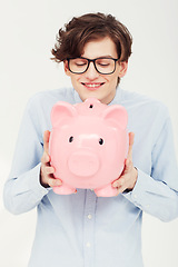 Image showing Piggy bank, smile and man with finance, business and planning isolated on a white studio background. Person, model and entrepreneur with savings, transactions and investment with payment and excited
