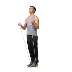 Image showing Training, man and resistance band for workout in studio, gym and happy in fitness by strong muscles. Sports person, exercise and commitment with stretching in mockup and cardio on white background