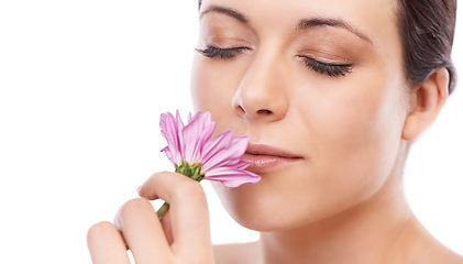 Image showing Woman, skincare and smell flower with beauty, natural change or memory in studio by white background. Girl, model or person with scent, floral plant or idea for thinking, choice and cosmetic results
