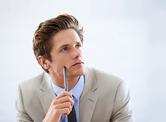 Image showing Businessman, thinking and ideas in studio for company growth and contemplating future in career. Male person, professional and planning by white background, entrepreneur and working on startup