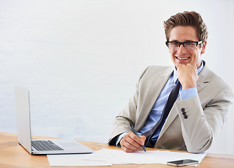 Image showing Business man, computer and paperwork in office portrait for financial planning, taxes or accounting management. Accountant or auditor in glasses with documents, writing report and laptop for research