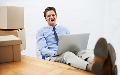 Image showing Businessman, moving boxes and happy on laptop, portrait and online logistics for courier delivery. Male person, professional and laughing for company distribution, package and shipment by internet