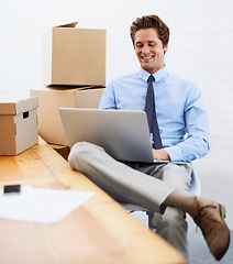 Image showing Business man, shipping boxes and happy by laptop, entrepreneur and online logistics for courier. Male person, professional and delivery for company distribution, package and technology or internet