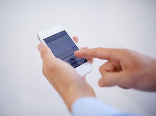 Image showing Hands, phone and typing on screen for communication or text message in studio, texting and conversation. Smartphone, person and replying or speaking online, contact and discussion by white background