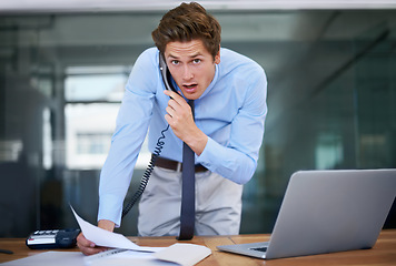 Image showing Businessman, landline and discussion in office portrait, paperwork and communication or planning. Male professional, contact and networking on phone call for negotiation on business deal opportunity