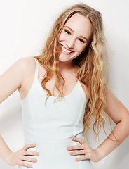 Image showing Fashion, style and confident portrait of woman with a smile in white background of studio. Happy, model and hands on hips with pride in formal, trendy outfit and lady with beauty and joy on backdrop