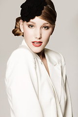 Image showing Woman, portrait and vintage fashion in studio with confidence, pride and elegant style with hairband. Person, face and designer outfit with hair accessory or classic for aesthetic on white background
