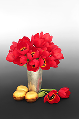 Image showing Luxury Gold Easter Eggs and Red Tulip Flowers