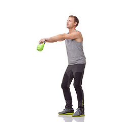 Image showing Training, workout and studio man with kettlebell for muscle growth, strength development or weightlifting performance. Gym equipment, weight lifting technique and sports athlete on white background