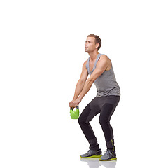Image showing Training, exercise and studio man with kettlebell for muscle growth, strength development or weightlifting routine. Gym equipment, weight lifting hard work and strong body builder on white background