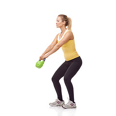 Image showing Training, strong and studio woman with kettlebell for arm muscle growth, strength power development or weightlifting. Sports club equipment, active workout and female bodybuilder on white background