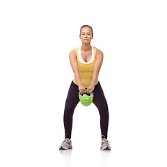 Image showing Workout, portrait or studio woman with kettlebell swing for muscle growth, strong arm strength or heavy weight lifting. Exercise equipment, gym circuit routine or bodybuilder girl on white background