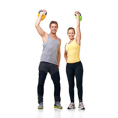 Image showing Studio portrait, kettlebell exercise and happy people celebrate muscle growth, strength progress or weightlifting success. Winner, bodybuilding achievement and athlete team goals on white background