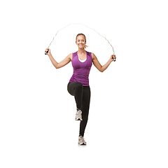 Image showing Portrait, skipping rope and woman on a white background for exercise, cardio workout and training. Sports, fitness and isolated person with gym equipment for health, wellness and jumping in studio