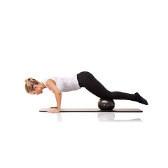 Image showing Fitness, exercise and woman on mat with ball for pilates, body building care and health in studio. Gym, training and girl on floor with cardio, energy and muscle workout isolated on white background.