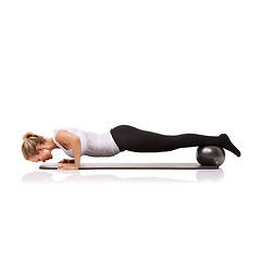 Image showing Fitness, push up and woman on floor with ball for pilates, body building care and health in studio. Gym, training and girl on mat with power, energy and muscle workout isolated on white background.