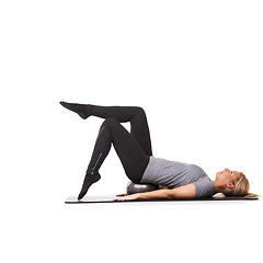 Image showing Workout legs, pilates and woman on ball in exercise, training and healthy body isolated on a white studio background mockup space. Floor, mat and person on equipment for sports, balance or fitness