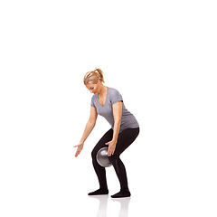 Image showing Exercise knee, pilates and woman on ball in workout, training and healthy body isolated on a white studio background mockup space. Legs, balance or person on equipment for squat, fitness or wellness