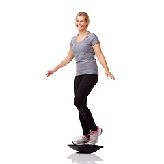 Image showing Fitness, portrait and woman with balance board, smile and healthy body workout at gym studio. Exercise, stability and happy girl with wellness, pilates training and tools isolated on white background