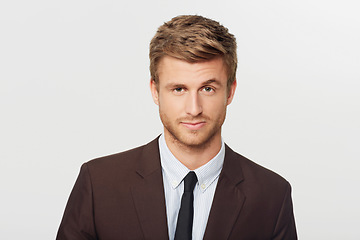 Image showing Portrait, serious and a young business man in studio isolated on white background for a corporate career. Face, question and raised eyebrow with a confident young employee in a suit as a professional
